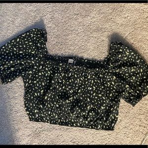 Off the shoulder blouse with yellow flowers.